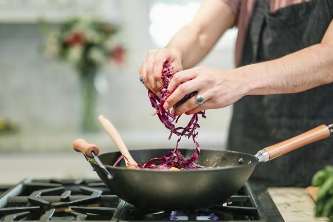 Cooking vegetables in wok - 7 Tips for New Vegans